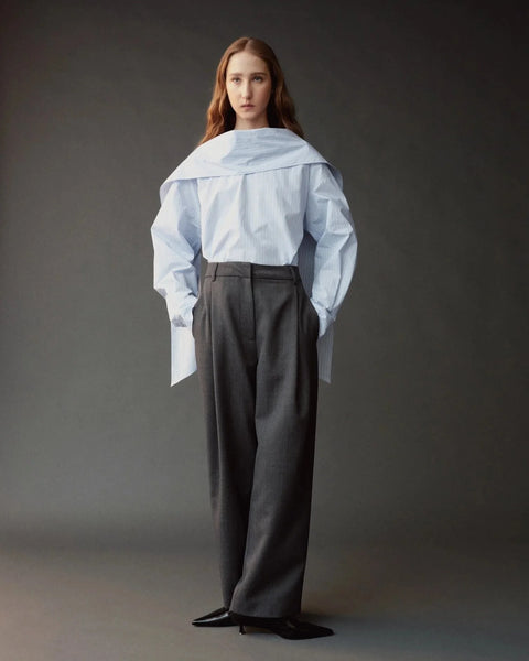 Mijeong Park Tie Neck Blouse in Light Blue - Flat Lay Showing Relaxed Fit Cotton Blouse with Rounded Hem