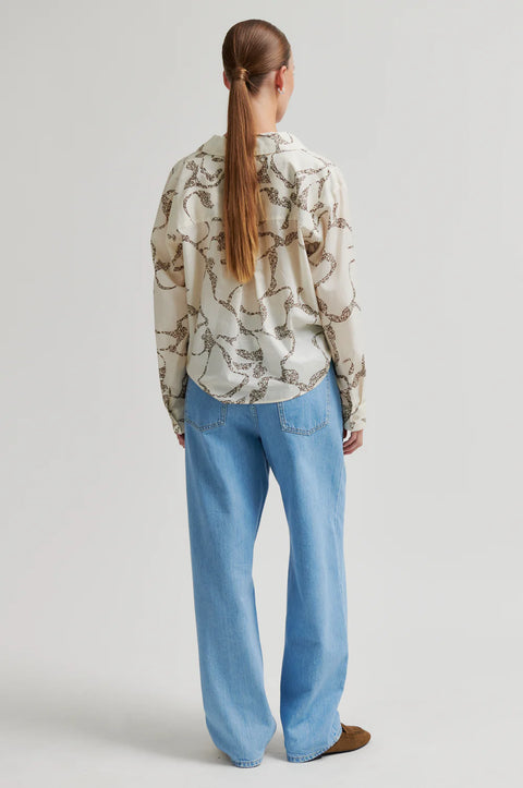 Second Female Eggnog Printed Twist Shirt - Close-Up of Semi-Sheer Cotton Print and Twisted Hem Detail