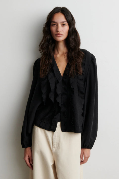 Second Female Rayna Frill Blouse Black - Side View Highlighting Straight Hem and Relaxed Lyocell Silhouette