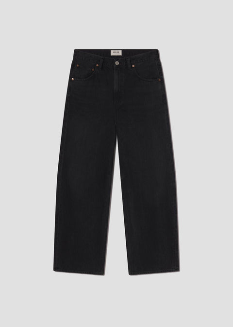 mid-rise fit black denim with a subtle, curved outseam that gently tapers for a flattering silhouette.