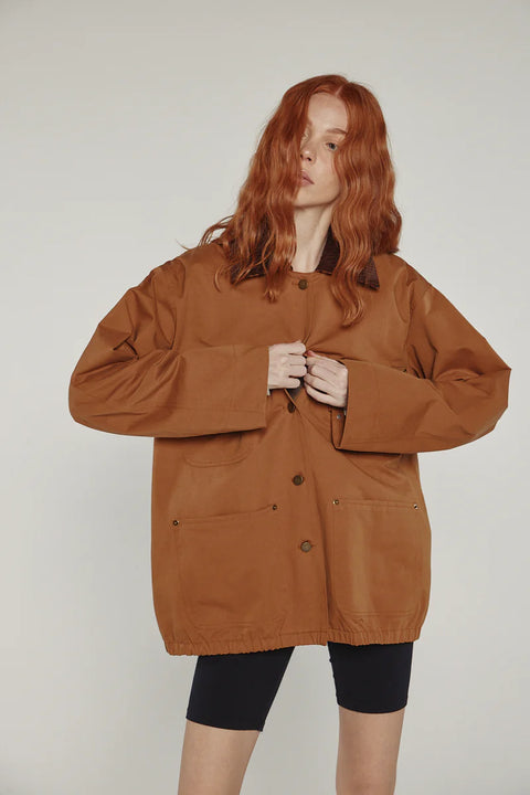 Durable cotton jacket, worker jacket style with buttons down the front, boxy fit, patch pockets, 100% cotton. Amente Cotton Worker Jacket in Brown