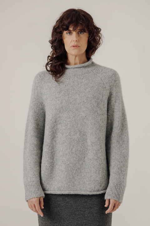 Grey sweater, oversized classic fit, made from alpaca and cotton, seamless rollback neckline, brand is Bare Knit