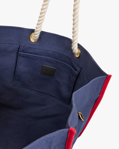 Clare V Beach Marine Navy Tote - Side View Highlighting Spacious 9.5-Inch Depth and Sturdy Cotton Canvas Construction