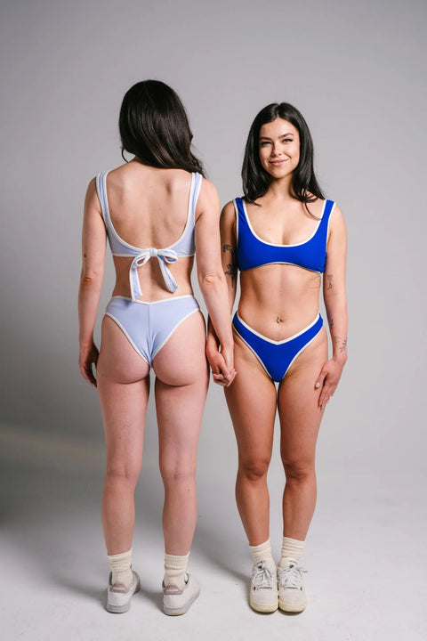 Light blue bikini top, form fitting with wide shoulders and adjustable tie back. Double lined and made of 100 Polyamide Elastane Blend. Boat Club Brand