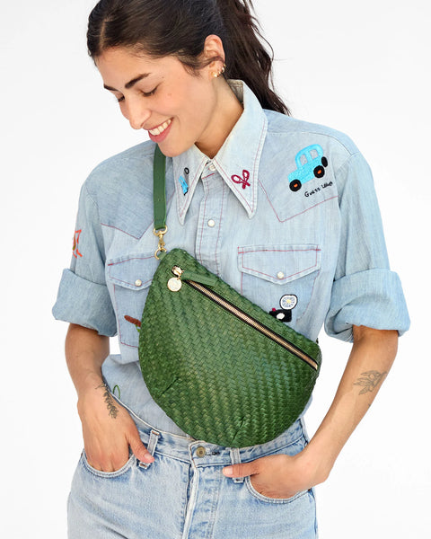 Fanny pack type purse, crossbody, bum bag, or shoulder bag. With a detachable, adjustable, interchangeable strap, made from unlined, perforated Italian leather.