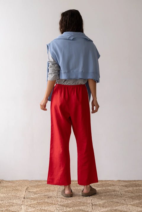 lightweight linen cropped pants in red with double white strip down the leg. Elastic waistband and cropped inseam and a wide leg fit.