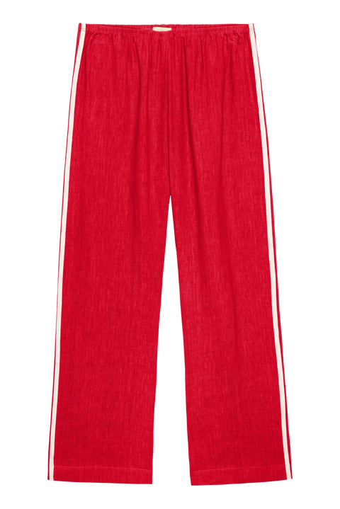 lightweight linen cropped pants in red with double white strip down the leg. Elastic waistband and cropped inseam and a wide leg fit.