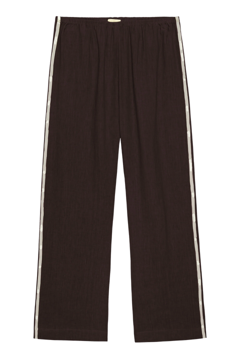 DONNI lightweight linen cropped pants in brown with double white strip down the leg. Elastic waistband and cropped inseam and a wide leg fit.