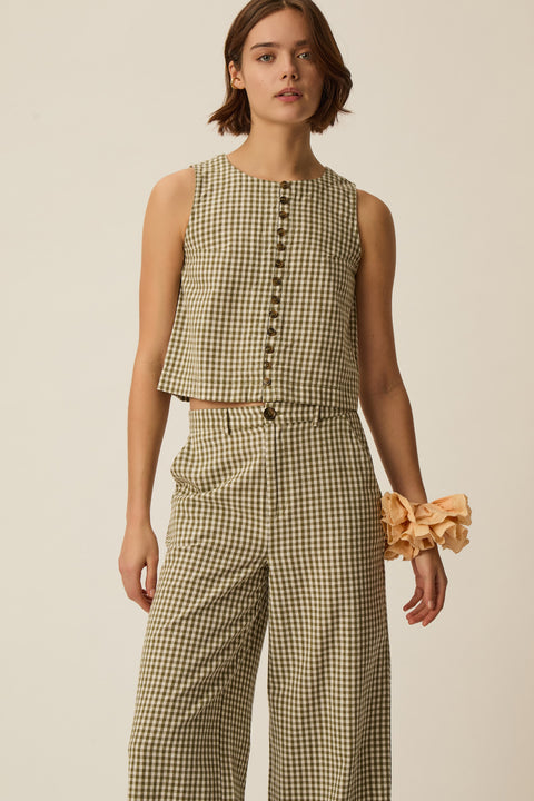 Full, Gingham sleeveless top, retro style, cotton and linen blend, horn-effect buttons and designed to hit at the waist.