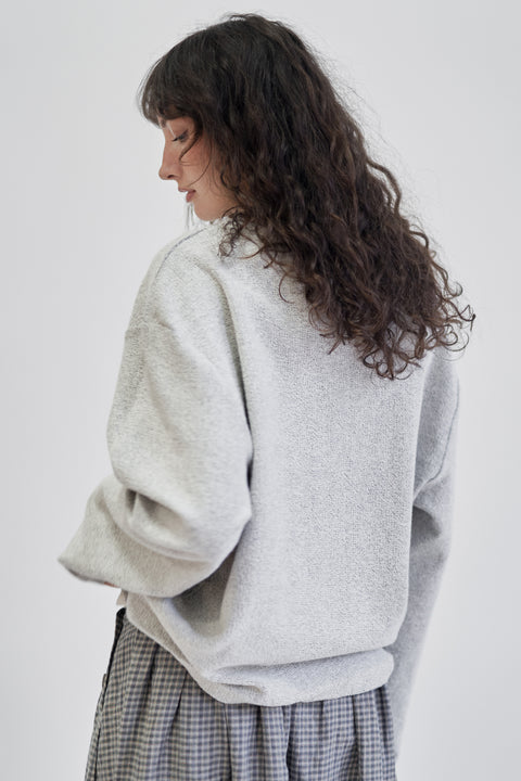 Terry cotton relaxed light grey crew sweater, unisex, relaxed sleeve, drop shoulder, and a clean, almost rolled hem at the neck