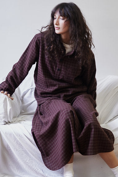 midi length skirt with a slightly curved hem and side slit, finished with side-seam pockets and a contrast waist tie for comfort and the perfect fit