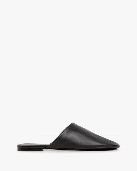 Soft leather black slide, rubber sole, chic slides are bisected with a clean seam through the upper