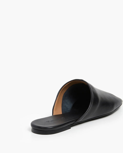 Soft leather black slide, rubber sole, chic slides are bisected with a clean seam through the upper