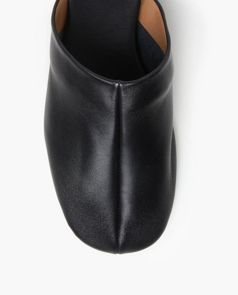 Soft leather black slide, rubber sole, chic slides are bisected with a clean seam through the upper
