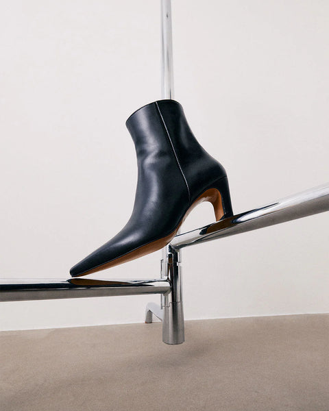 contoured heel, elongated toe, inner zip detailing and made from leather. 2.16” heel, classic shape and look.