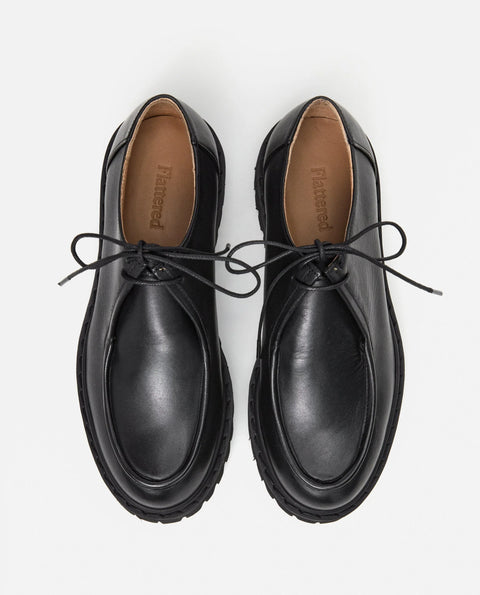 Loafer shoe with a lace up design. Made by flattered. Everyday show for men or women.