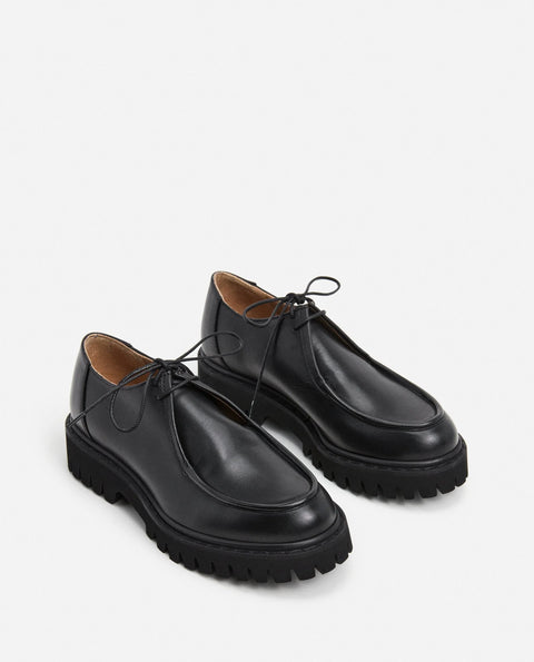 Loafer shoe with a lace up design. Made by flattered. Everyday show for men or women.