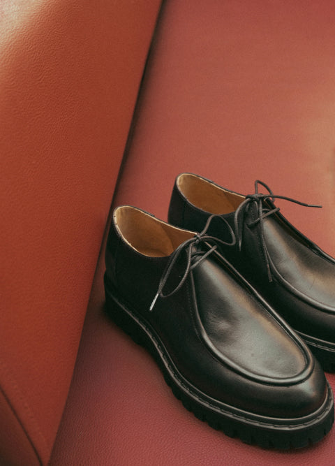 Loafer shoe with a lace up design. Made by flattered. Everyday show for men or women.