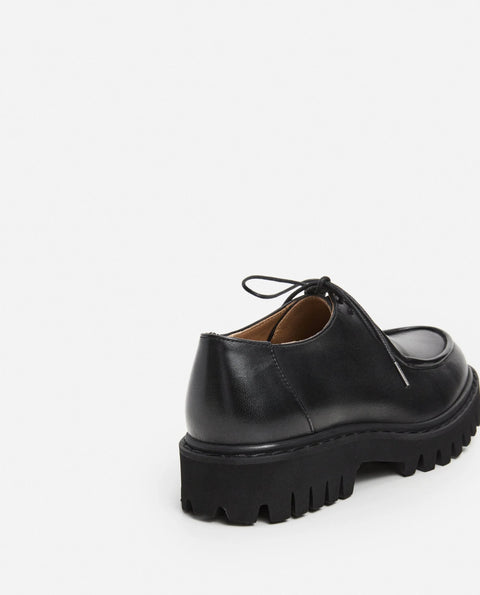 Loafer shoe with a lace up design. Made by flattered. Everyday show for men or women.