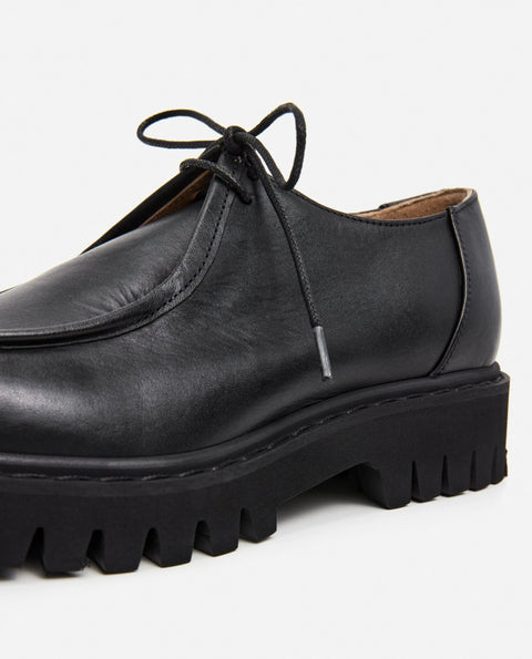 Loafer shoe with a lace up design. Made by flattered. Everyday show for men or women.
