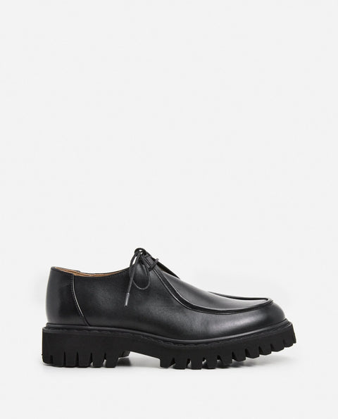 Loafer shoe with a lace up design. Made by flattered. Everyday show for men or women.
