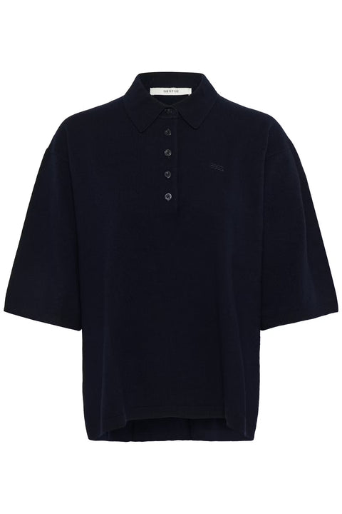 Black wool knit polo shirt with a boxy silhouette, dropped shoulders, five-button placket, and elbow-length wide sleeves.