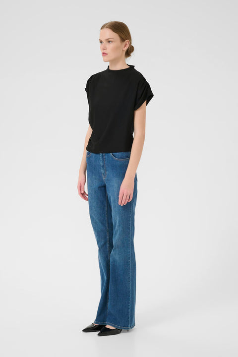 Classic minimalist cream mock neck top with cap sleeves. structured fabric.