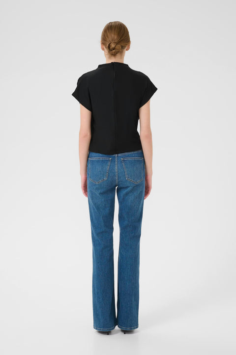 Classic minimalist cream mock neck top with cap sleeves. structured fabric.