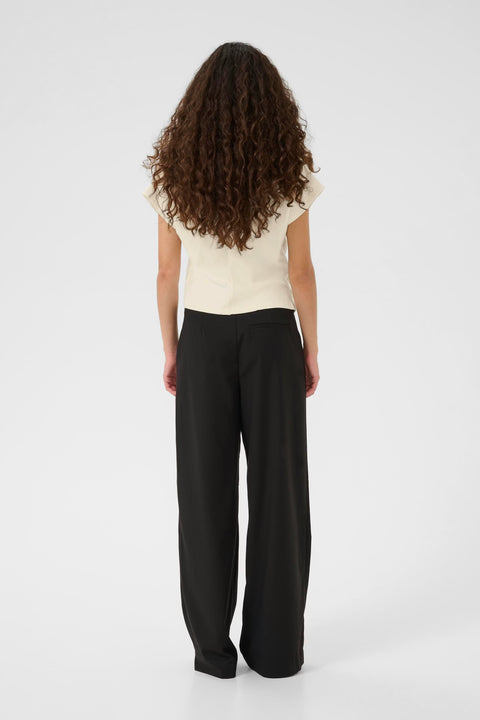 Classic minimalist cream mock neck top with cap sleeves. structured fabric.