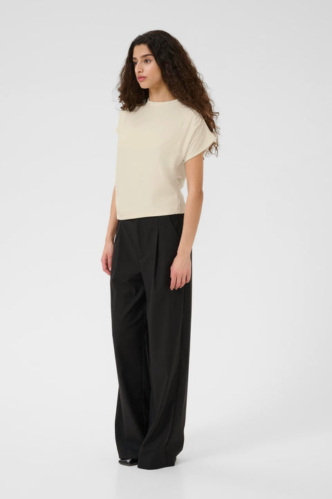 Classic minimalist cream mock neck top with cap sleeves. structured fabric.