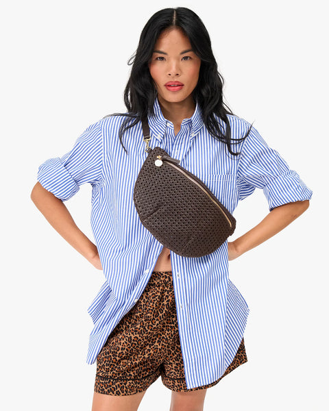 Front view of Clare V chocolate rattan Grande Fanny pack – 12.75" x 8" woven leather belt bag with adjustable strap