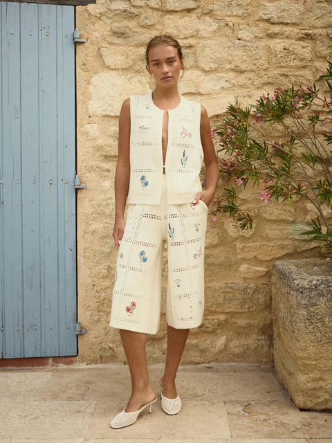 Notshy Lali Vest in Ecru – sleeveless wool and cashmere crochet vest with patchwork knit texture, single button detail and large floral embroidery on the back