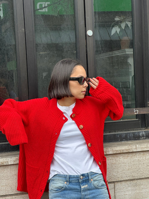 Givéh Red Coco Cardi – relaxed red wool cashmere cardigan with two pockets and Givéh embroidery detail, styled on model