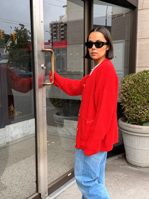 Givéh Red Coco Cardi – hand knit red statement cardigan with pocket embroidery, side view