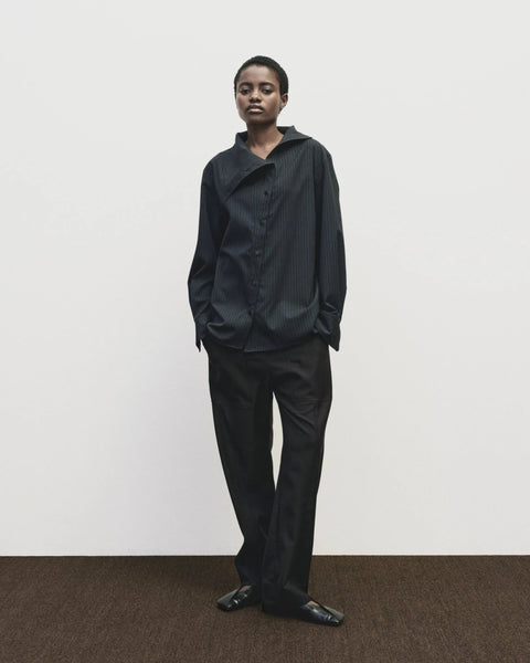 Asymmetric Striped collar Shirt in navy by Mijeong Park. exaggerated funnel neck and asymmtrical button front - big and baggy oversized fit