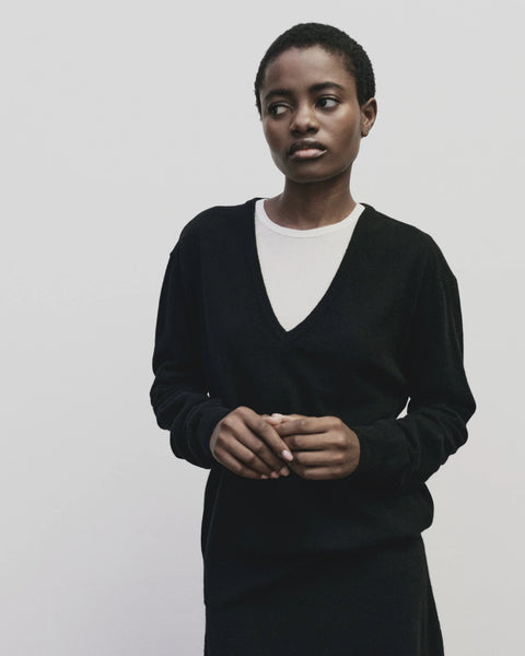 merino wool, blended with a touch of cashmere for an extra-luxe fabric, relaxed fit, v-neck, long sleeve sweater ribbed trim. Mijeong Park Cashmere sweater in black