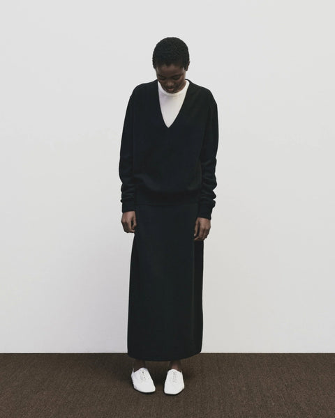 merino wool, blended with a touch of cashmere for an extra-luxe fabric, relaxed fit, v-neck, long sleeve sweater ribbed trim. Mijeong Park Cashmere sweater in black