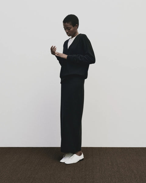 merino wool, blended with a touch of cashmere for an extra-luxe fabric, relaxed fit, v-neck, long sleeve sweater ribbed trim. Mijeong Park Cashmere sweater in black