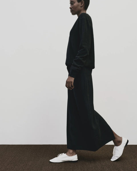 merino wool, blended with a touch of cashmere for an extra-luxe fabric, relaxed fit, v-neck, long sleeve sweater ribbed trim. Mijeong Park Cashmere sweater in black