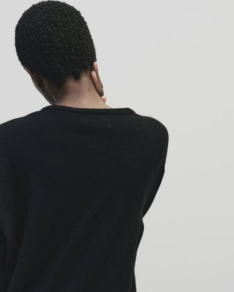 merino wool, blended with a touch of cashmere for an extra-luxe fabric, relaxed fit, v-neck, long sleeve sweater ribbed trim. Mijeong Park Cashmere sweater in black