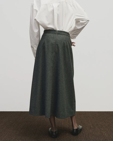 Wool long skirt. Pleated skirt by Mijeong Park. Classic kilt and elongates it to the ankle with an a-line silhouette and pleated, wrap-front detail. Fully lined