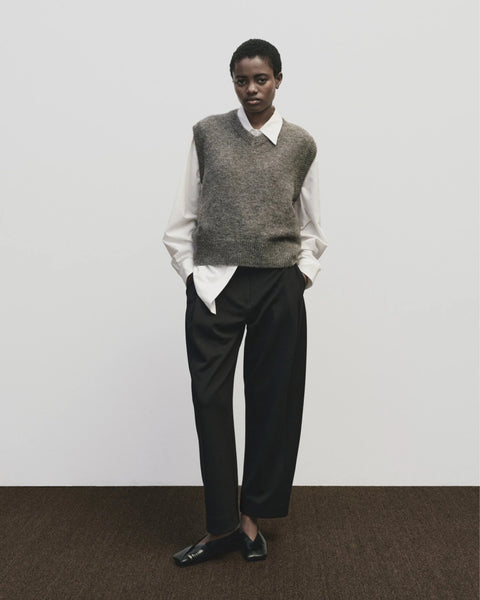 Classic sweater vest, in a relaxed oversized fit, wool blend, V neck with ribbed trims. Mijeong Park Wool Blend V-Neck Vest in Heather Brown