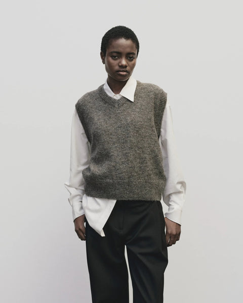 Classic sweater vest, in a relaxed oversized fit, wool blend, V neck with ribbed trims. Mijeong Park Wool Blend V-Neck Vest in Heather Brown