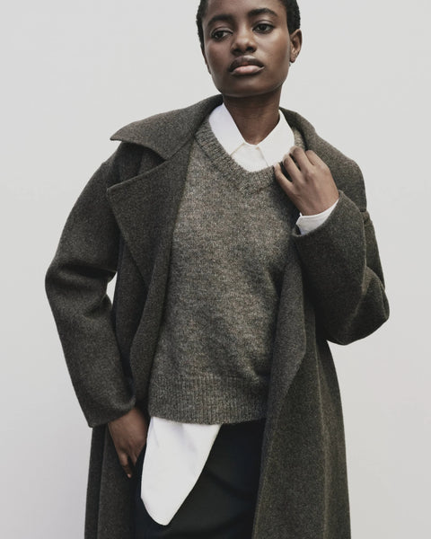 Classic sweater vest, in a relaxed oversized fit, wool blend, V neck with ribbed trims. Mijeong Park Wool Blend V-Neck Vest in Heather Brown
