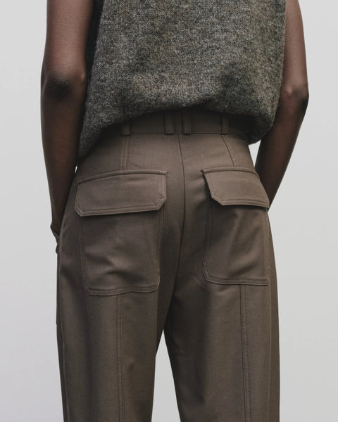 Relaxed fit pants with straight leg and oversized pockets. Buttons on the waist and cuff for adjustability. Trouser by Mijeong Park
