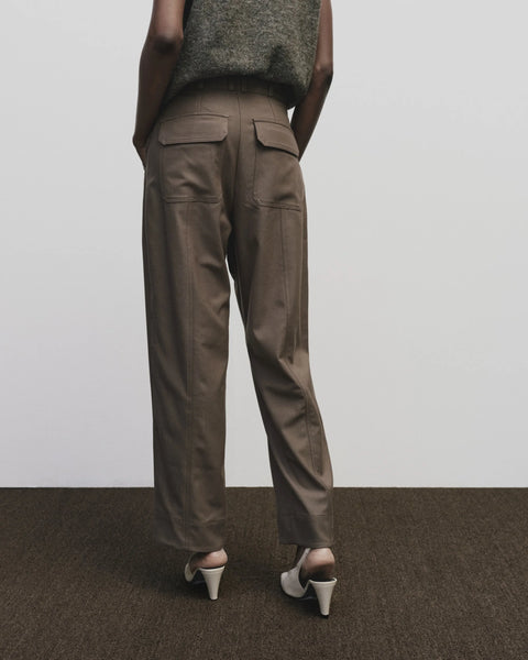 Relaxed fit pants with straight leg and oversized pockets. Buttons on the waist and cuff for adjustability. Trouser by Mijeong Park