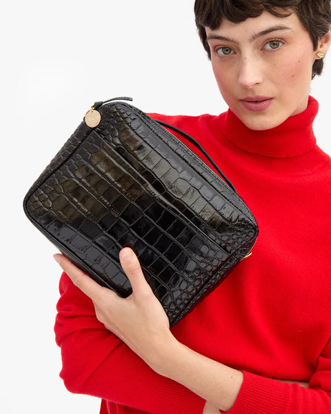 Clare V Mirabel Crossbody Bag in Black Embossed Croco leather – top handle and detachable crossbody strap, styled on model