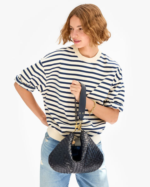 Clare V Moyen Messenger Twilight Navy Diagonal Woven - styled on model as crossbody bag with 36.5" strap