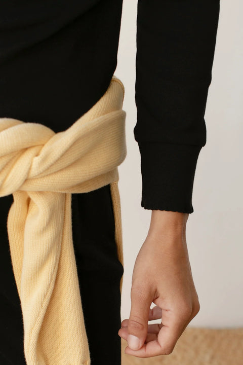 DONNI The Baby Rib Scallop Long Sleeve in Jet - Styled Shot Showing Black Ribbed Top Layered for Everyday Wear