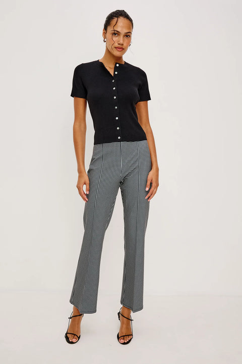 Black ribbed knit button front top full outfit styled with trousers
